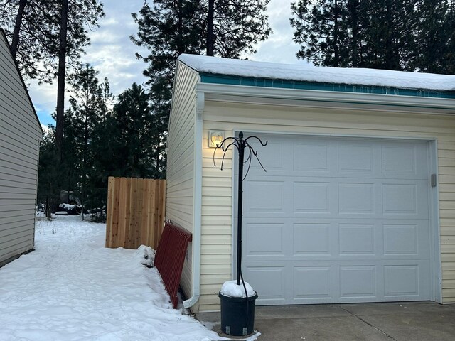 single story home featuring a garage and covered porch