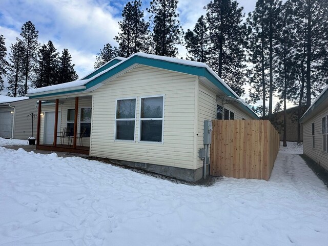 view of snow covered garage