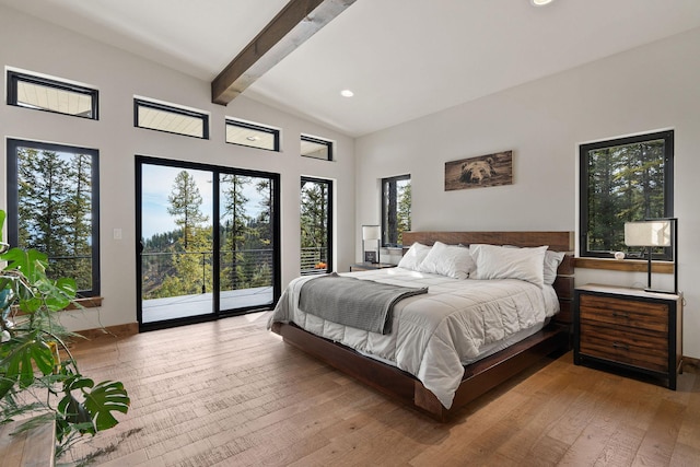 bedroom with light hardwood / wood-style flooring, access to outside, and vaulted ceiling with beams