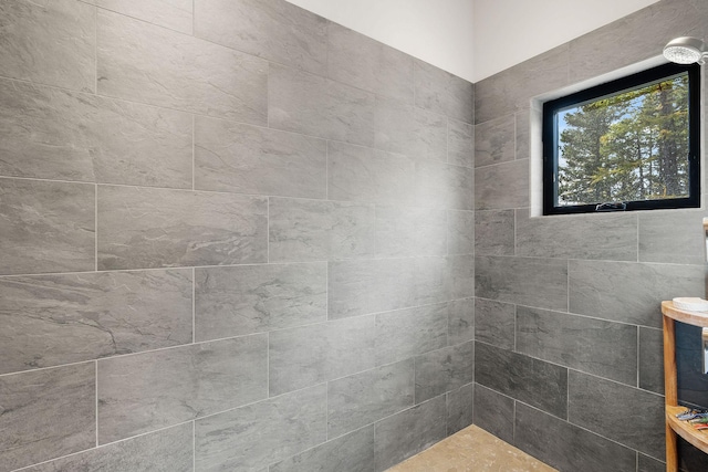 bathroom with tiled shower