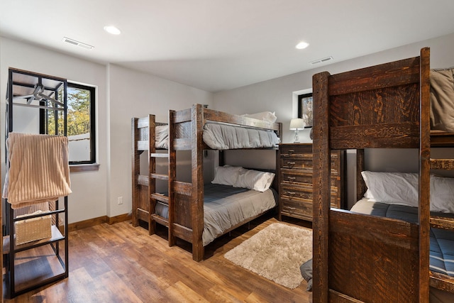 bedroom with hardwood / wood-style floors