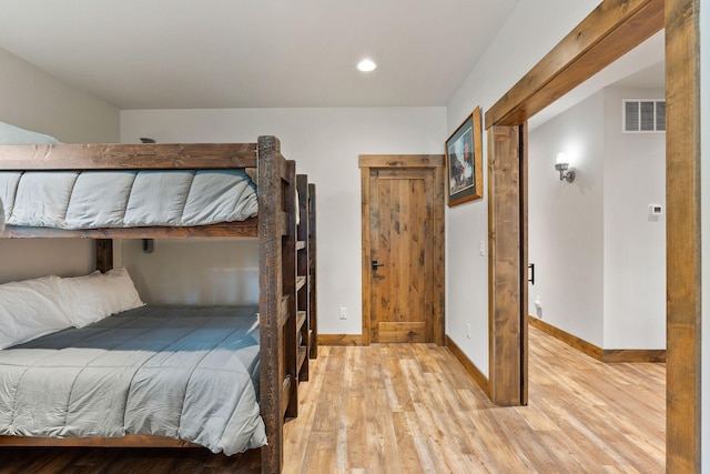 bedroom with light wood-type flooring