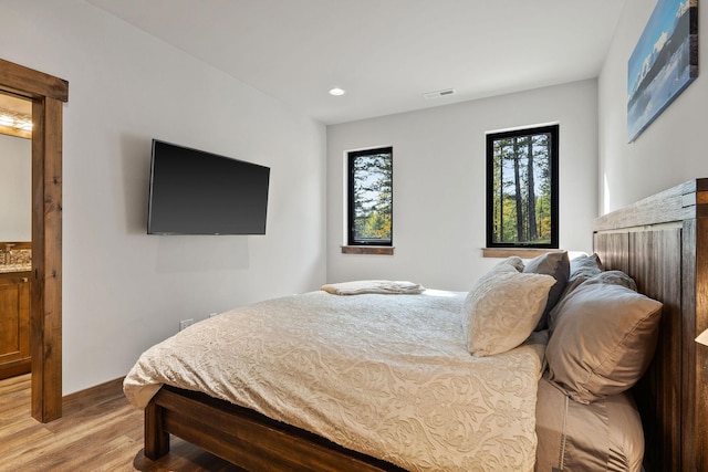 bedroom featuring hardwood / wood-style flooring