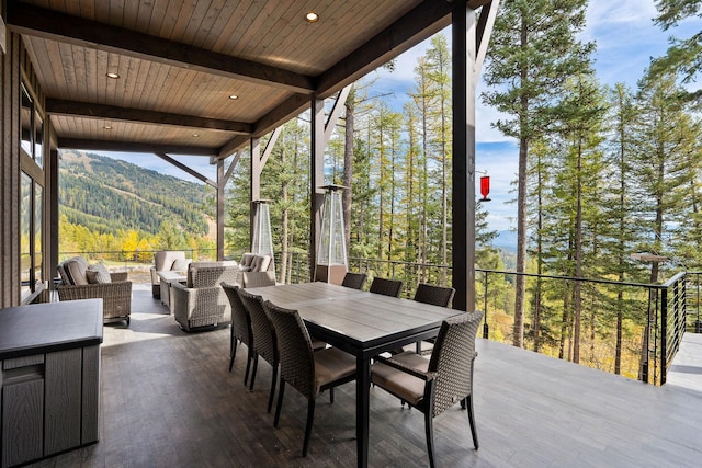 view of patio featuring a mountain view and an outdoor living space