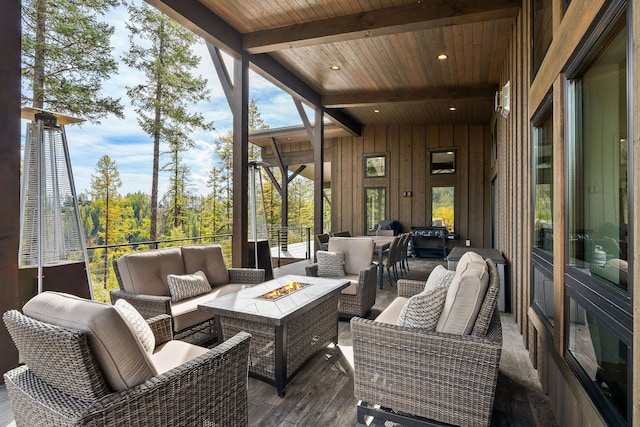 exterior space featuring beamed ceiling and wooden ceiling