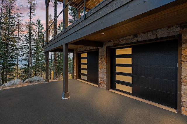 view of front of property with a deck and a garage