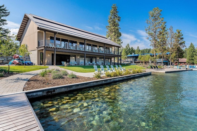 dock area featuring a lawn