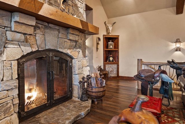 living room with dark hardwood / wood-style floors, a fireplace, and lofted ceiling