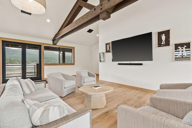 living room with french doors, wood-type flooring, and lofted ceiling with beams