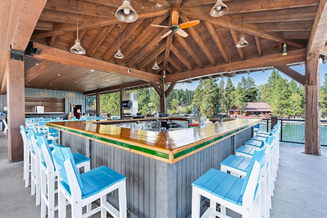 view of patio with a gazebo, an outdoor bar, and ceiling fan