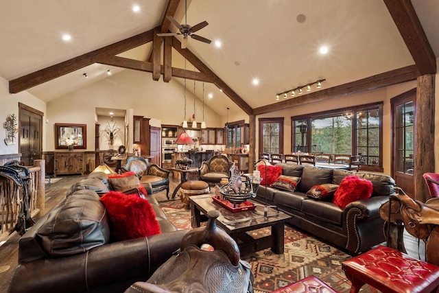 living room featuring rail lighting, beam ceiling, high vaulted ceiling, and ceiling fan