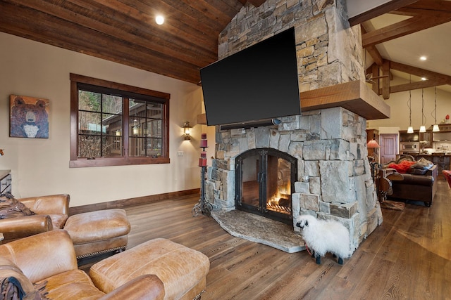 living room featuring hardwood / wood-style flooring, wooden ceiling, a fireplace, and lofted ceiling