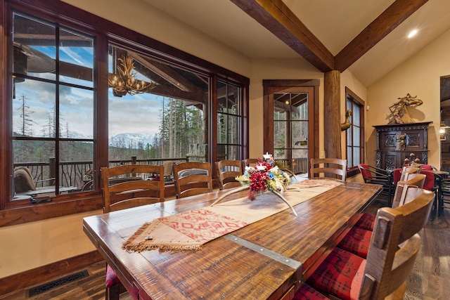 dining room featuring a mountain view, a chandelier, dark hardwood / wood-style flooring, and lofted ceiling with beams