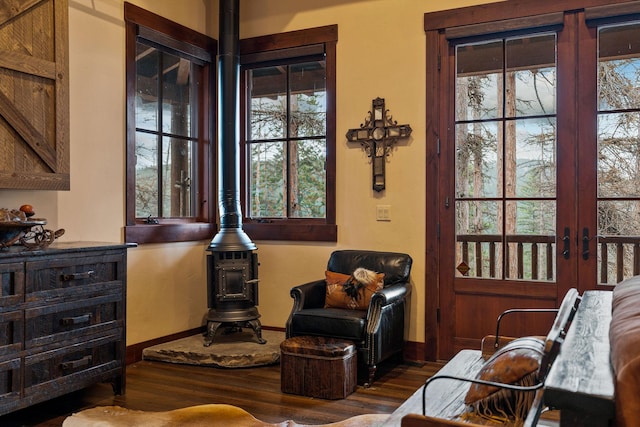 sitting room with dark hardwood / wood-style floors and a healthy amount of sunlight