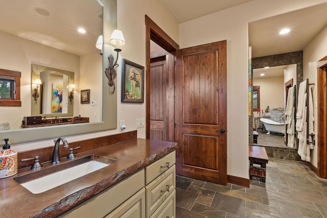 bathroom featuring vanity and a bathing tub