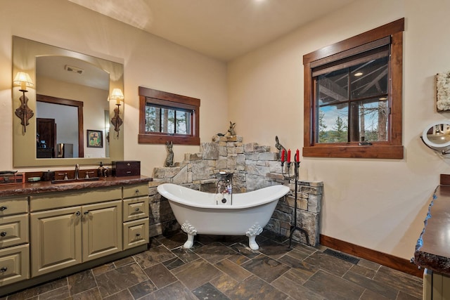 bathroom with a bathtub and vanity