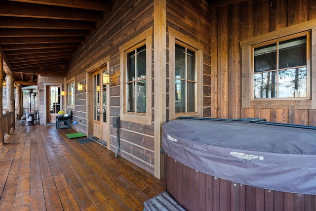 deck with a hot tub