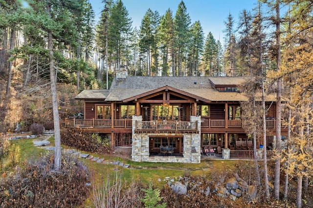 back of property with a patio area and a wooden deck