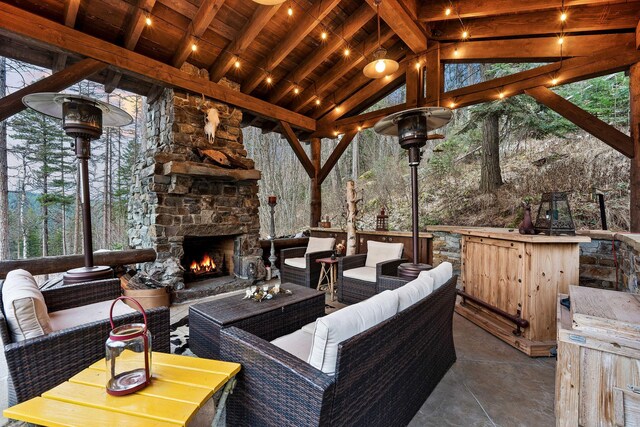 view of patio featuring an outdoor living space with a fireplace