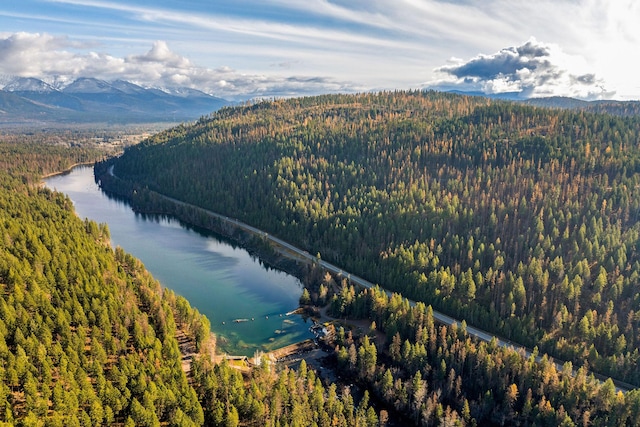 aerial view featuring a water and mountain view