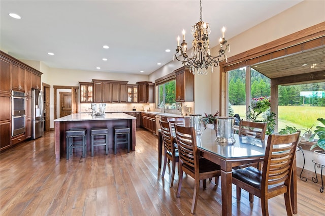 dining area featuring sink and dark hardwood / wood-style flooring