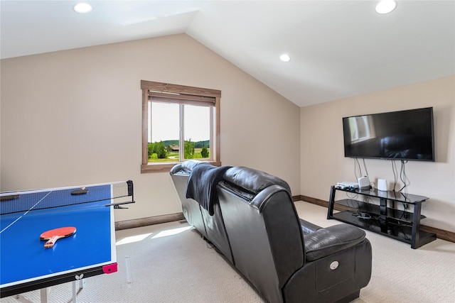 living room featuring light colored carpet and vaulted ceiling