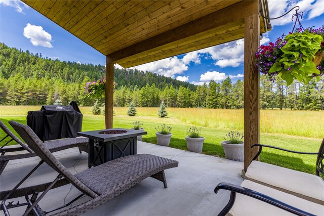 view of patio / terrace featuring a fire pit