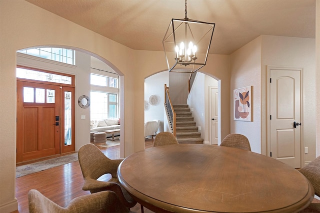 dining area with an inviting chandelier and light wood-type flooring