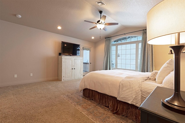 carpeted bedroom with ceiling fan, a textured ceiling, and vaulted ceiling