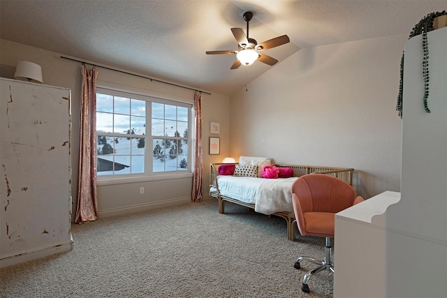 bedroom featuring lofted ceiling, carpet, and ceiling fan