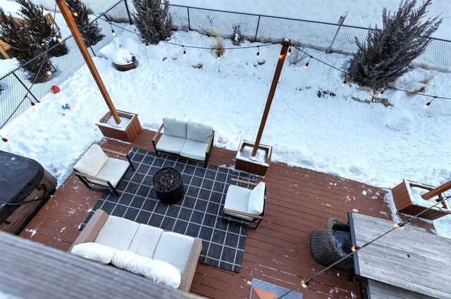 view of snow covered deck