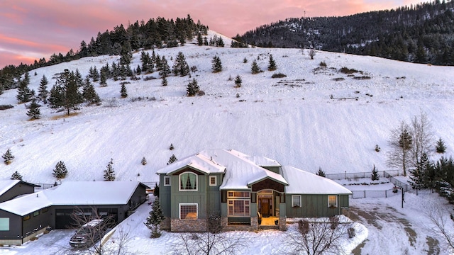 snowy aerial view with a mountain view