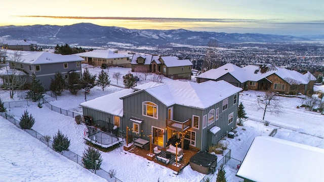 snowy aerial view with a mountain view