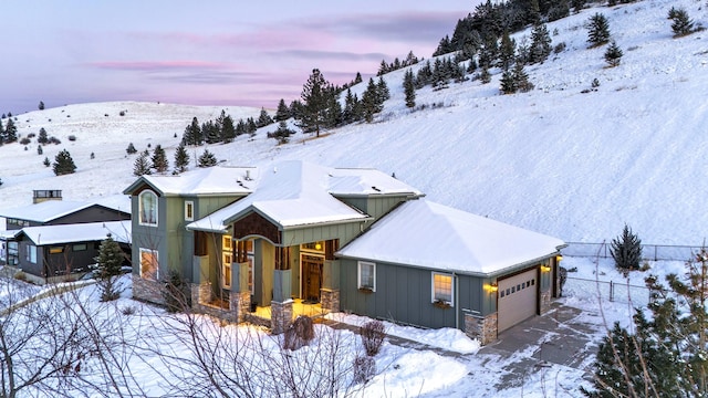 snowy aerial view with a mountain view