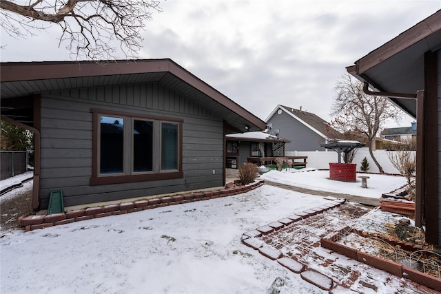 view of snow covered house