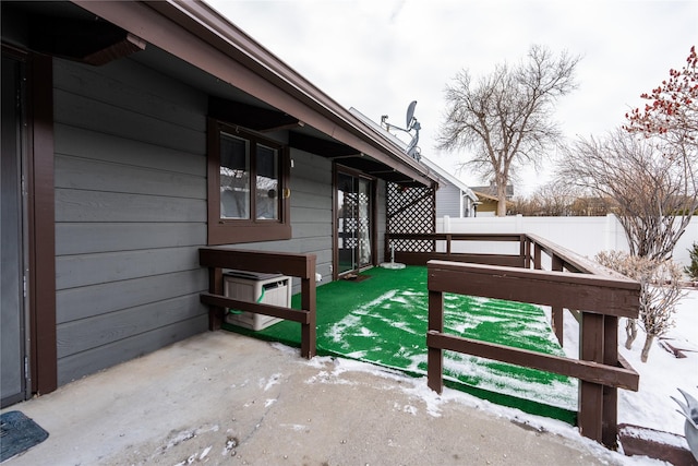 wooden terrace featuring a fenced backyard