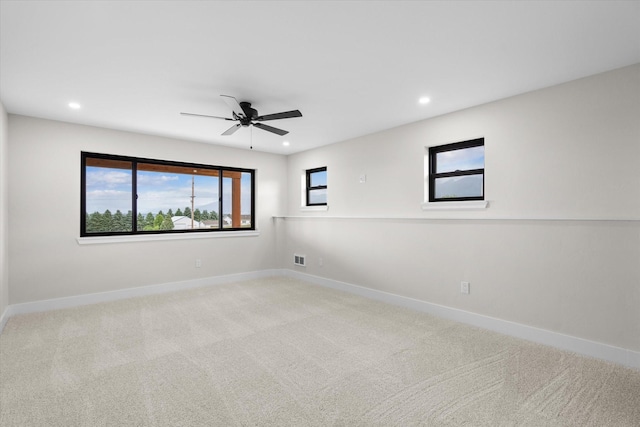 carpeted empty room with ceiling fan