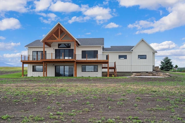 rear view of house with a wooden deck