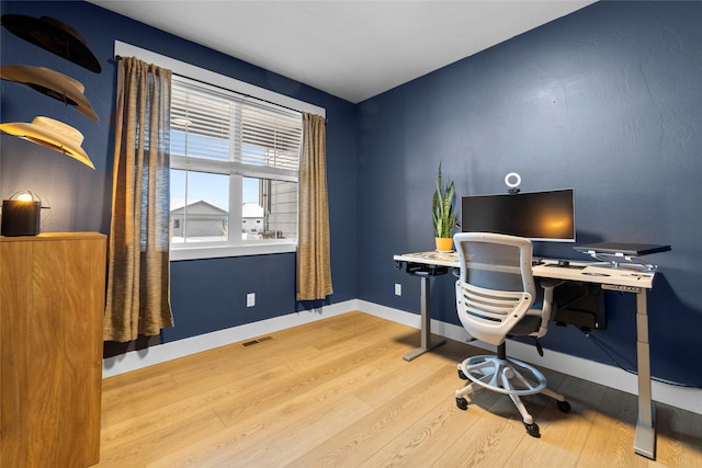 office area with wood-type flooring