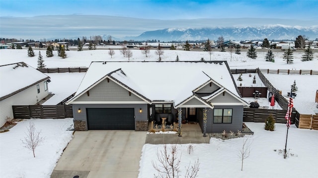 snowy aerial view with a mountain view