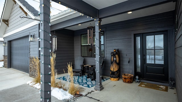 doorway to property featuring a garage