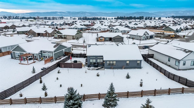 snowy aerial view with a mountain view