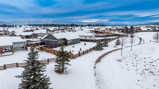 snowy aerial view with a mountain view