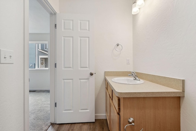 bathroom with vanity and wood-type flooring