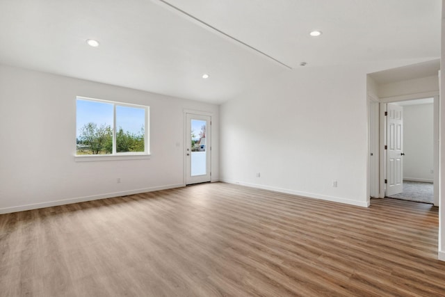 spare room featuring light hardwood / wood-style flooring