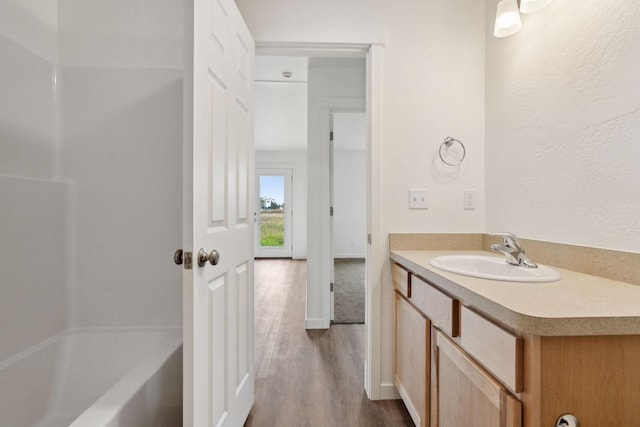 bathroom featuring hardwood / wood-style flooring and vanity