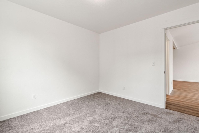 unfurnished room with carpet flooring