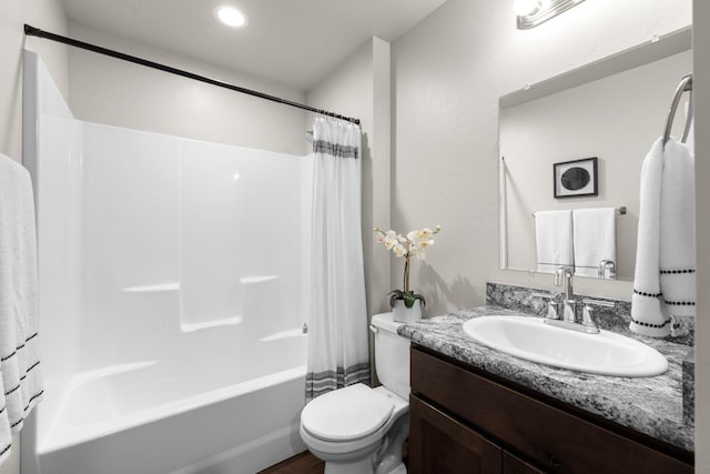 full bathroom with toilet, vanity, and shower / bath combination with curtain