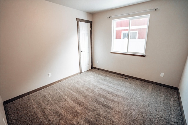 empty room featuring carpet flooring