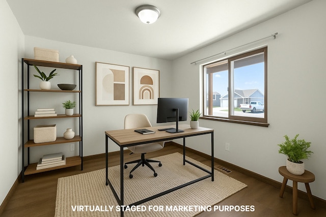 office space featuring wood finished floors and baseboards